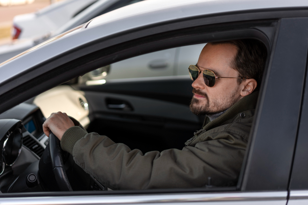 An image showing a person driving a car.