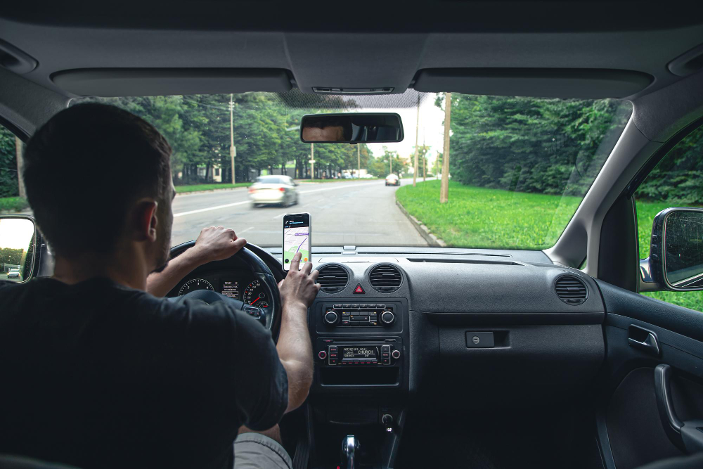 A man sitting in his car during rush hour