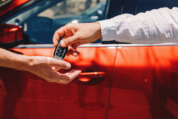 a-man-receiving-car-keys-for-a-rental-vehicle
