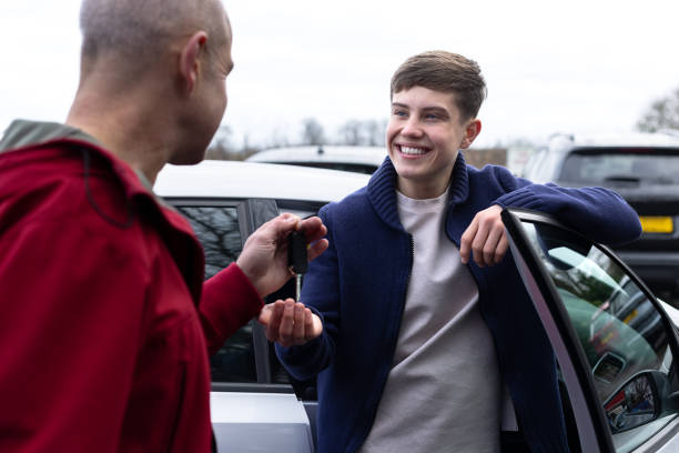 young-driver-receiving-car-keys