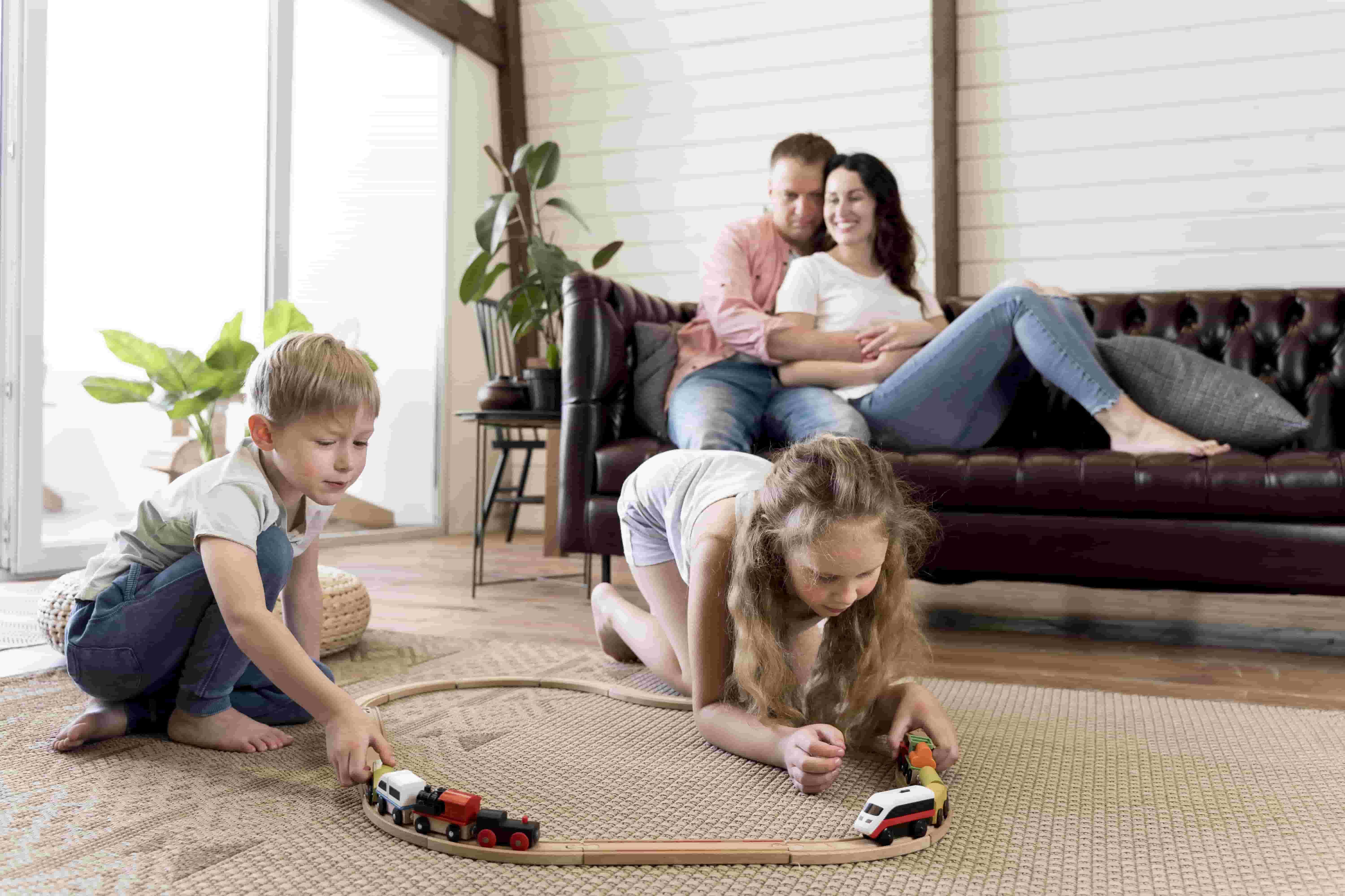 full-shot-parents-watching-children-play-(1)-min-(1)